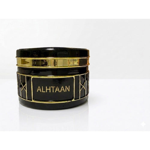 عطر عود الهتان الفاخر الأسود بالخطوط الذهبية من متجر Aromatic Harmony